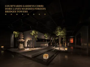 indoor garden with several trees in pots, creating a lush atmosphere, well-lit and spacious