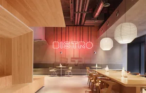 Inviting modern dining space with multiple chairs, benches, and a red neon sign reading Bistro, set against a neutral background