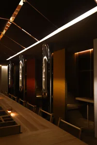 Cozy restaurant with booths and tables, multiple chairs, and a warm atmosphere for socializing and dining