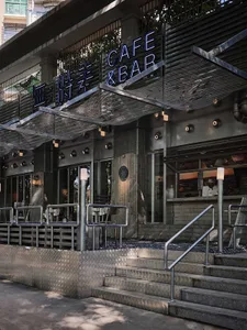 Spacious Asian restaurant with multiple dining tables and chairs, gray and white tones, and an inviting atmosphere
