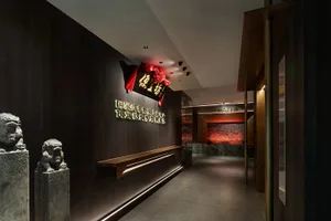 Warm and inviting Asian restaurant with wooden interior, traditional decorations, and a counter with seating