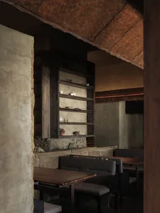 Warm and inviting restaurant interior with wooden tables and chairs, suitable for social gatherings or family meals