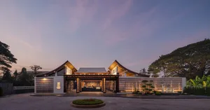 Spacious Asian-style restaurant with wooden structure, potted plants, and a warm atmosphere