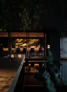 Warm and inviting restaurant bar with a wooden countertop, comfortable seating, and well-lit space