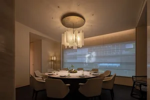 Sophisticated dining area with a round table, wine glasses, and fine china