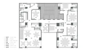 2D floor plan of a modern hotel with multiple rooms, dining areas, and sitting areas, featuring clear labels and linework