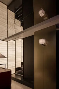 Modern kitchen with dual sinks, a dining table, and well-lit atmosphere