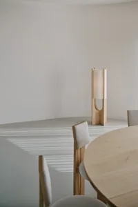 Empty dining area with a wooden table and chairs, creating a calm and inviting atmosphere