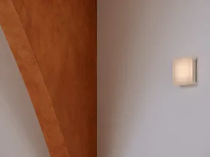 A warm and rustic wood panelled wall in a room, possibly a hallway or living area