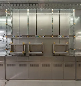 Industrial kitchen with stainless steel ovens, shelves, and cabinets, giving a professional and functional feel