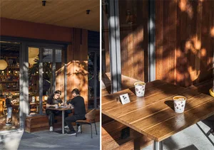 Dining area with wooden furniture, a table, chairs, and a window, set up for a meal