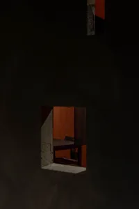 A dimly lit dining room with a wooden table and metal/plastic chairs, creating a cozy atmosphere through a doorway or window