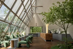 A spacious open area with various seating options, potted plants, and a welcoming atmosphere, ideal for socializing and relaxation