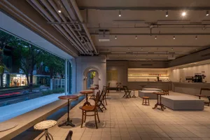 Open concept dining and kitchen space with chairs, a dining table, and a kitchen area, featuring a bright and inviting atmosphere