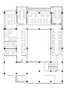 2D floor plan of an empty restaurant interior with multiple seating areas and tables, clean and organized layout