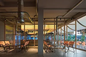Inviting restaurant interior with multiple chairs and tables, comfortable seating, and ample dining space