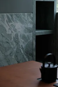 Marble bathroom with dual sinks, marble countertop, and elegant design