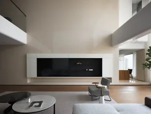 Open modern living area with a flat screen TV, chairs, and a couch, surrounded by clean lines and minimalistic decoration