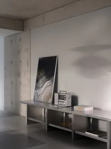 An organized office space with a desk, clocks, and various items, conveying a sense of productivity and functionality