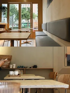 A welcoming cafe with wooden tables and chairs, creating a cozy atmosphere with a focus on comfort and warmth