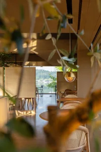 Dining area with multiple chairs and tables, inviting atmosphere, and comfortable seating for social gatherings
