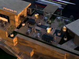 Outdoor dining area with tables, chairs, and umbrellas, surrounded by boats and a possible harbor view