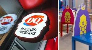 Red signs for DQ Blizzard Burgers and DQ on a wall with a chair in the background