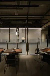Elegant restaurant with glass walls, wooden floors, and minimalist decoration, featuring multiple dining tables and chairs