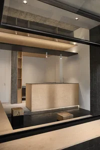 A warm and inviting kitchen space with wooden elements, sink, cabinets, and countertops