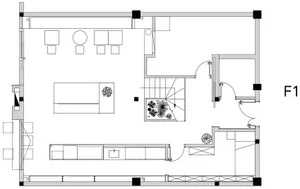 Empty white living room with a couch, two chairs, and a potted plant, creating a clean and minimalistic atmosphere