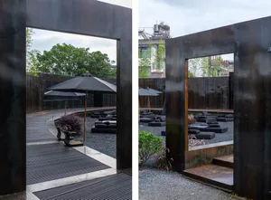 A well-designed outdoor patio with seating areas, umbrellas, and potted plants, creating a comfortable and inviting space for socializing and relaxation