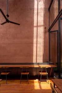 A warm and inviting dining area with a wooden table and chairs, surrounded by a cozy atmosphere