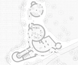 2D floor plan of a modern building with open areas, various rooms, and hallways