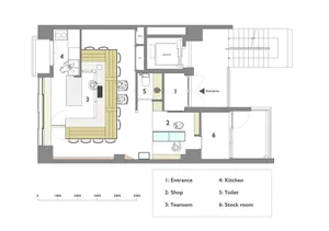 Black and white floor plan with kitchen, dining, living rooms, bedroom, and bathroom, featuring doors, windows, and staircases