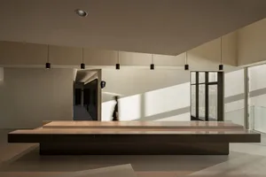 Well-lit lobby with a large countertop, two people, and inviting atmosphere