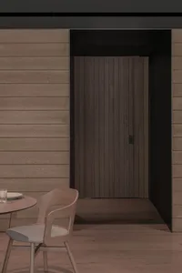 Warm dining space with a wooden table and chairs, set up for a meal or gathering