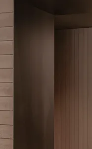 A wooden doorway with a brown frame leads to a darker area beyond, creating a sense of mystery