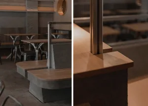 A well-lit restaurant interior with wooden countertops, dining tables, and comfortable seating, perfect for socializing and enjoying meals
