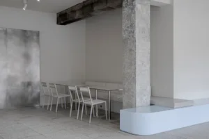 Modern restaurant interior with multiple tables and chairs, inviting atmosphere, and focus on functionality and comfort