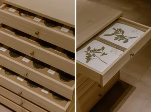 An organized office space with wooden cabinets and drawers, featuring books and a functional atmosphere