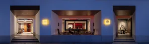Cozy dining area with comfortable seating, decorative vases, and a dining table with various items