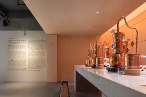 A modern bar or restaurant interior with metal storage units, exotic wall writings, and a stylish atmosphere