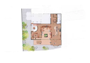 A modern residential interior with a neutral color palette, featuring a kitchen, dining room, and living room