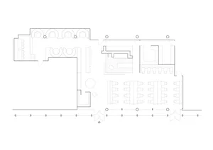 Modern restaurant interior with multiple dining tables, chairs, and a bar, featuring a functional and spacious design