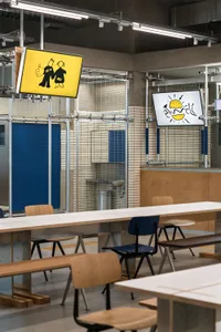 Empty cafeteria with wooden tables and chairs, clean and well-organized, ready for dining