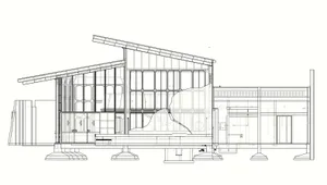 A modern house on stilts with a combination of wood and glass elements, situated in a coastal area with water nearby