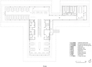 Black and white floor plan of a hotel or office complex with various rooms and spaces, including a dining area, kitchen, and multiple seating areas