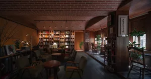 A cozy bookstore with wooden shelves, multiple chairs, and an abundance of books, creating a warm and inviting atmosphere