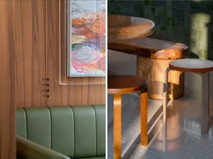 A modern dining space with a wooden table and chairs, featuring a bench in the background and multiple chairs around the table