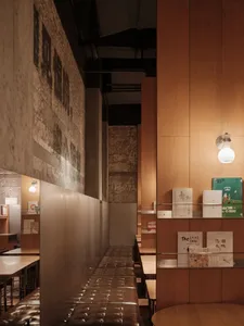 Warm and inviting restaurant interior with wooden walls and tables, comfortable seating, and a cozy atmosphere